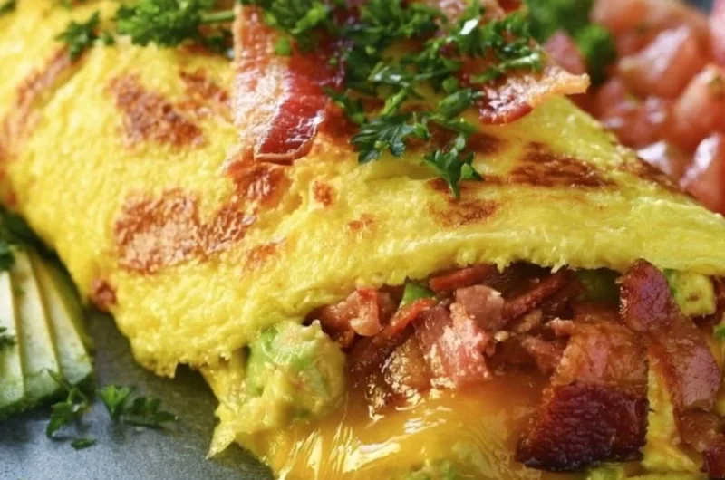 Keto Omelette filled with avocado and bacon for a healthy breakfast