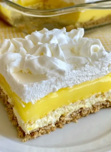 Lemon Delight dessert showcasing a vibrant lemon topping and creamy texture.
