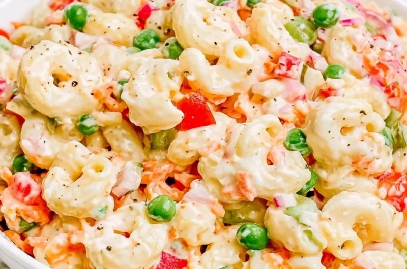 Delicious homemade macaroni salad with fresh vegetables and creamy dressing.