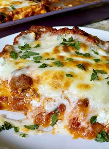 Delicious Sheet Pan Lasagna fresh out of the oven, served in a family-friendly style.