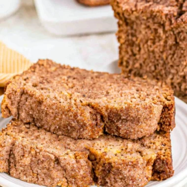 Slice of snickerdoodle banana bread topped with cinnamon sugar