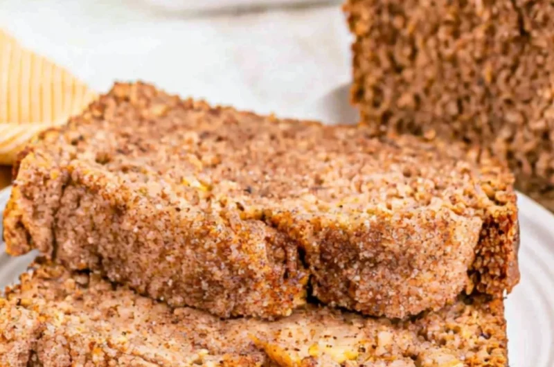 Slice of snickerdoodle banana bread topped with cinnamon sugar