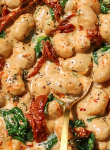 Creamy one pot sundried tomato white beans dish served in a bowl