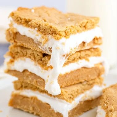 Delicious Fluffernutter Bars topped with peanuts and marshmallows