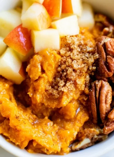 Sweet potato breakfast bowl with pecans and apples, a healthy warm breakfast dish