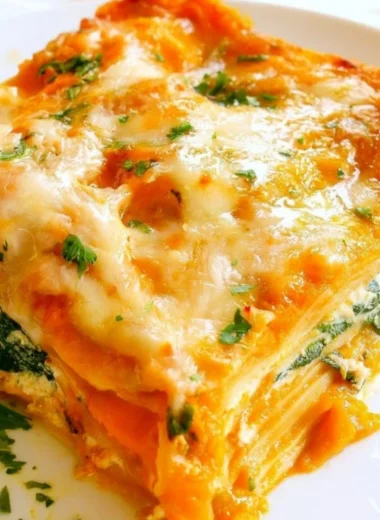 Vegetarian Pumpkin Spinach Lasagna layered with cheese and fresh spinach